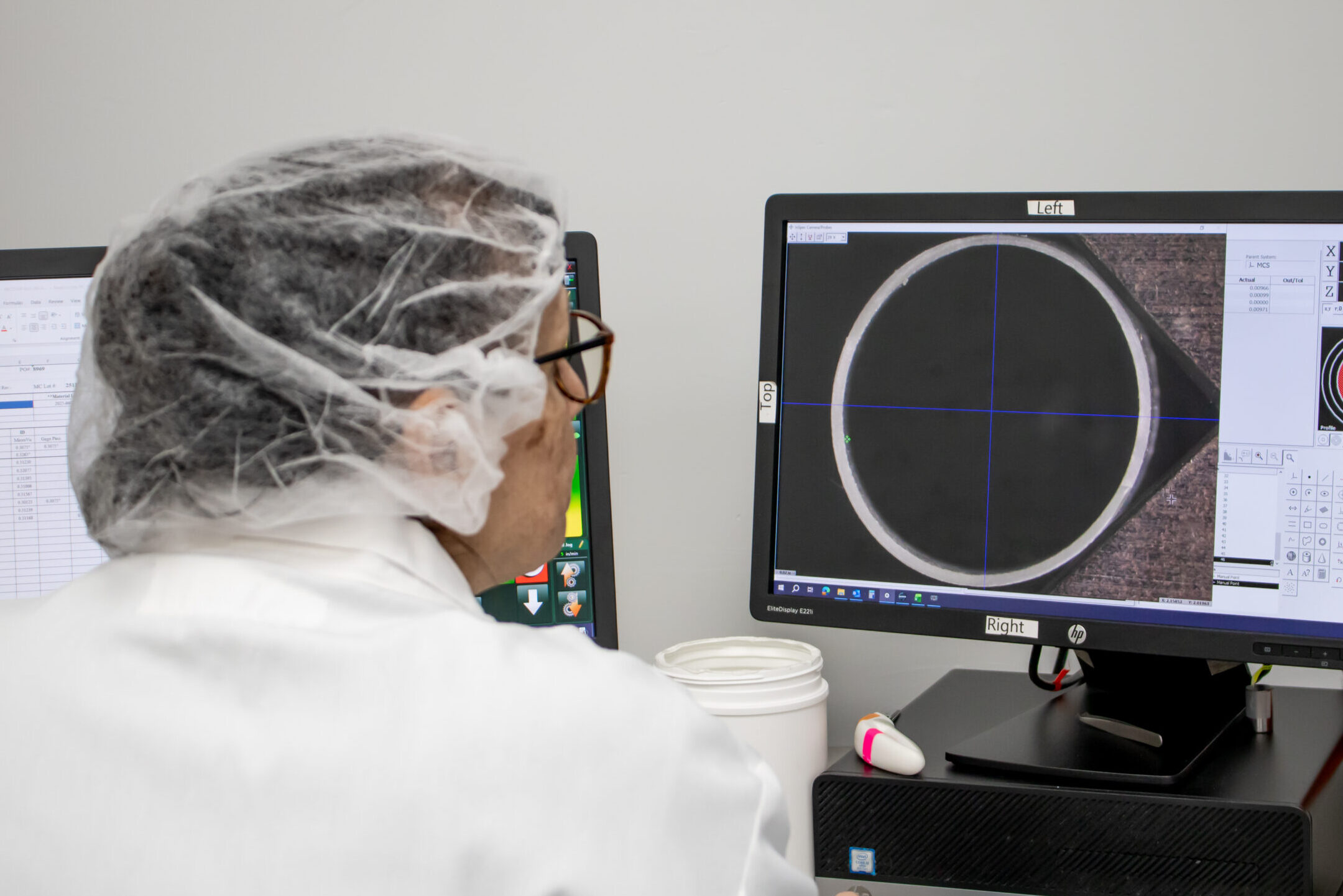 Quality technician reviewing thin wall extrusion tubing
